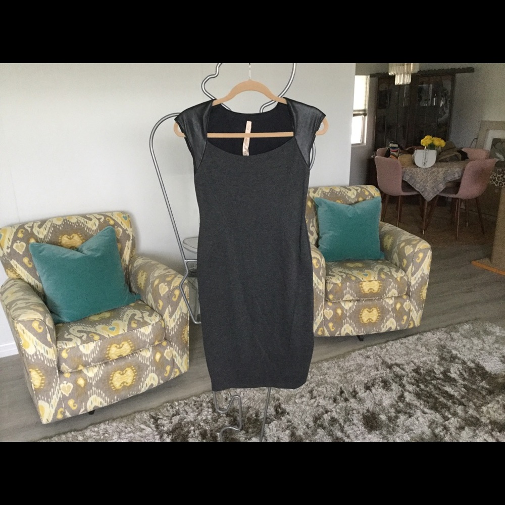 Form fitting little black leather and gray dress